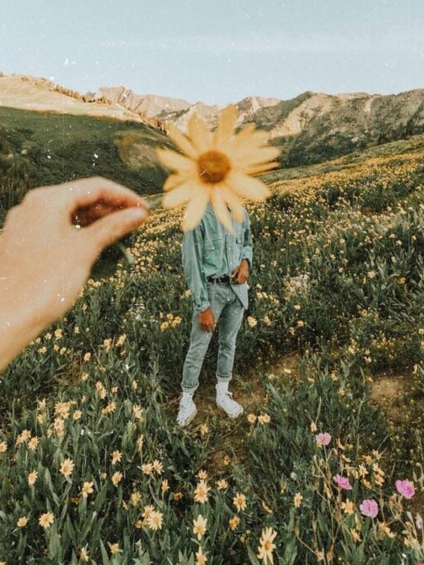 Person with flower over their face